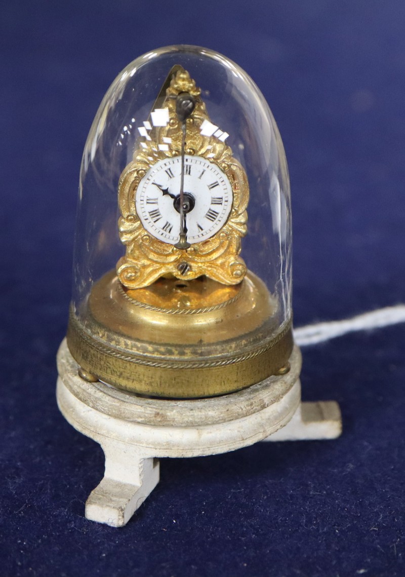 An Austrian miniature timepiece under a glass dome, overall height 5cm
